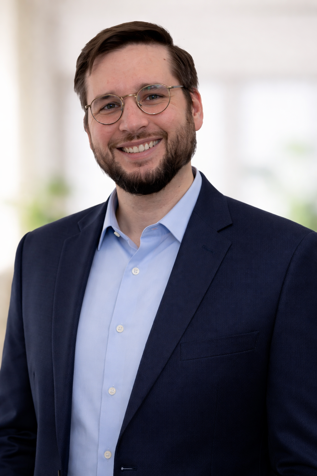 Ian Sugerman, Hudson Valley AI Partners consultant, smiling in front of Hudson Valley landscape